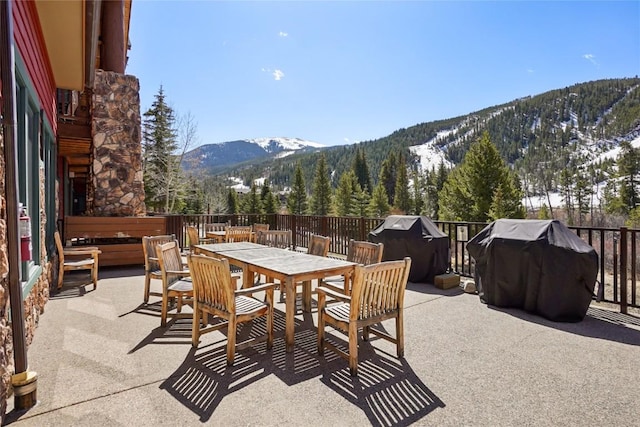 22714 US Highway 6 Unit 5941, Keystone, CO 80435 - view of patio / terrace featuring a mountain view, outdoor dining area, and a grill