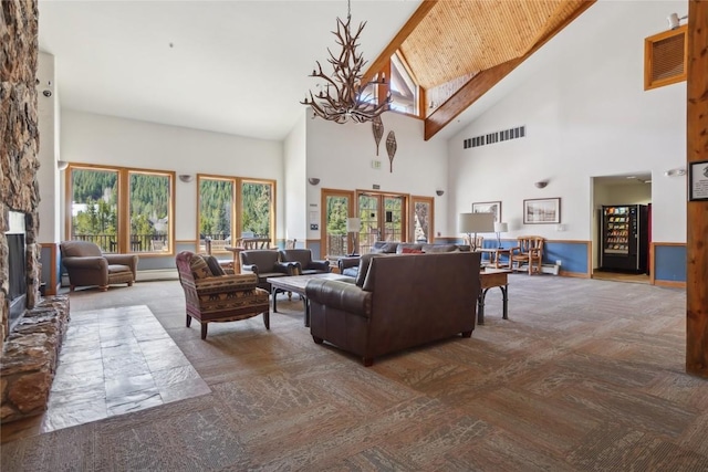 22714 US Highway 6 Unit 5941, Keystone, CO 80435 - living area featuring visible vents, carpet, a notable chandelier, and high vaulted ceiling