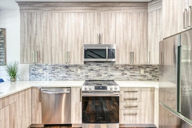 102 Lake Ridge Cir Unit 1888, Keystone, CO 80435 - kitchen with stainless steel appliances, modern cabinets, light brown cabinets, light countertops, and backsplash
