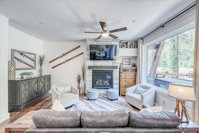 102 Lake Ridge Cir Unit 1888, Keystone, CO 80435 - living area featuring a ceiling fan, wood finished floors, and a large fireplace