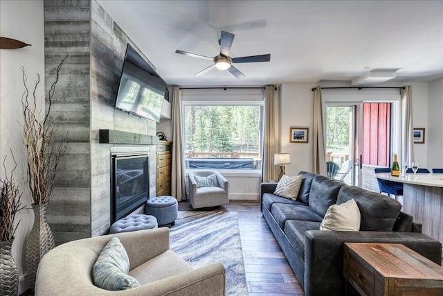 102 Lake Ridge Cir Unit 1888, Keystone, CO 80435 - living room with hardwood / wood-style flooring, a ceiling fan, and a glass covered fireplace