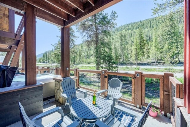 102 Lake Ridge Cir Unit 1888, Keystone, CO 80435 - deck with a wooded view and a mountain view