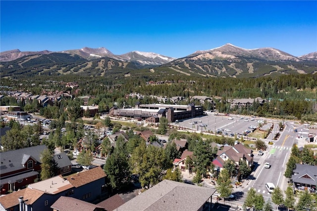 302 N Main St, Breckenridge, CO 80424 - aerial overview of property's location featuring a mountain backdrop and a forest
