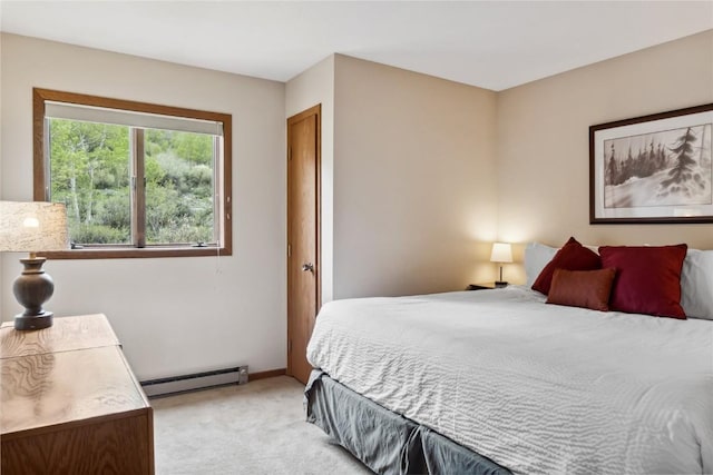23177 Barbour Dr Unit 14, Keystone, CO 80435 - bedroom featuring a baseboard heating unit and light carpet