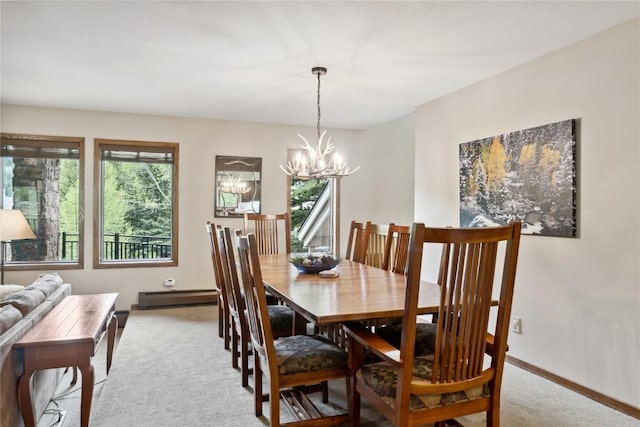 23177 Barbour Dr Unit 14, Keystone, CO 80435 - dining room with a chandelier, light colored carpet, and a baseboard heating unit