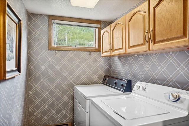 23177 Barbour Dr Unit 14, Keystone, CO 80435 - washroom featuring cabinet space, washing machine and clothes dryer, and a textured ceiling