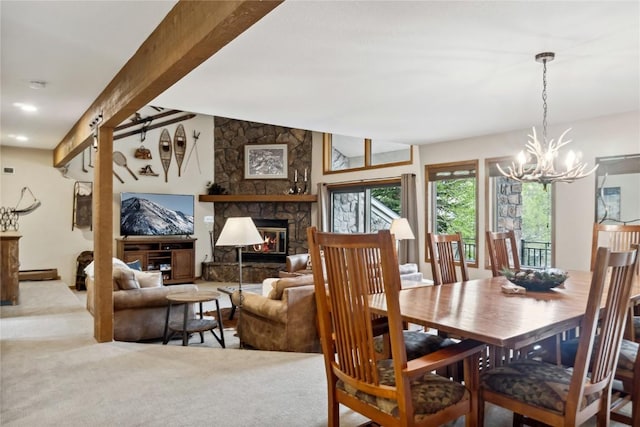 23177 Barbour Dr Unit 14, Keystone, CO 80435 - dining area with a chandelier, carpet flooring, a fireplace, and a baseboard radiator