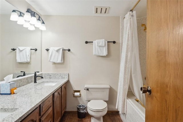 23177 Barbour Dr Unit 14, Keystone, CO 80435 - bathroom with double vanity, wood finished floors, and shower / bath combo with shower curtain