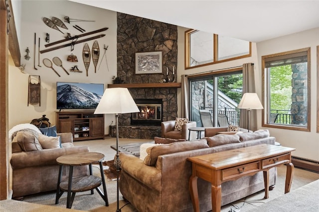23177 Barbour Dr Unit 14, Keystone, CO 80435 - living room with a stone fireplace, baseboard heating, and carpet floors