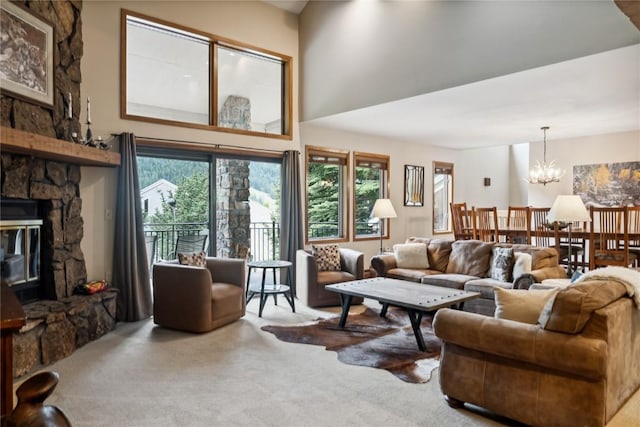 23177 Barbour Dr Unit 14, Keystone, CO 80435 - living room featuring carpet flooring, plenty of natural light, a stone fireplace, and a high ceiling