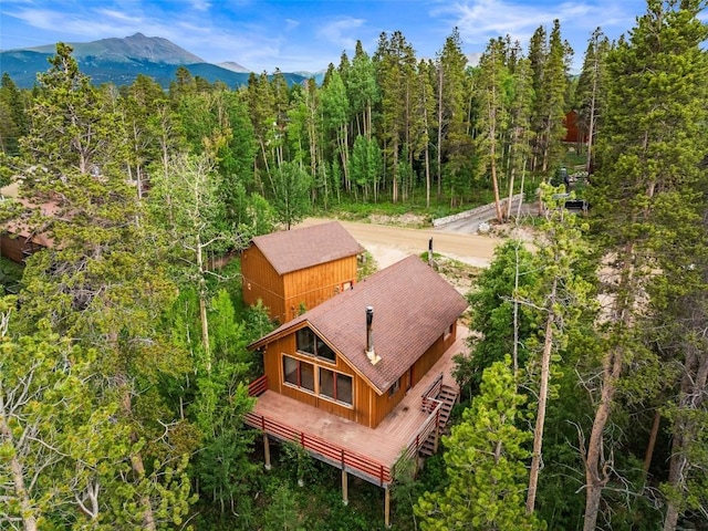 243 Lone Hand Way, Breckenridge, CO 80424 - view of subject property with a heavily wooded area and a mountain backdrop