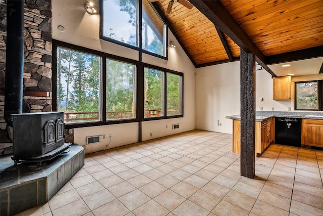 243 Lone Hand Way, Breckenridge, CO 80424 - unfurnished living room with a wood stove, a wood ceiling with exposed beams, light tile patterned floors, and high vaulted ceiling