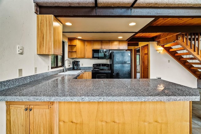 243 Lone Hand Way, Breckenridge, CO 80424 - kitchen with black appliances, tile counters, open shelves, a peninsula, and beam ceiling