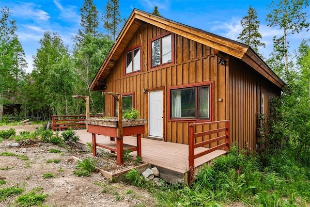 243 Lone Hand Way, Breckenridge, CO 80424 - view of home's exterior with board and batten siding and a wooden deck