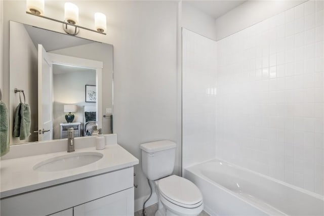 bathroom with vanity,  shower combination, and toilet
