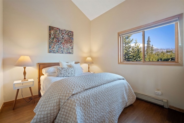 91400 Ryan Gulch Rd Unit 91425, Silverthorne, CO 80498 - bedroom featuring baseboard heating, lofted ceiling, and wood finished floors