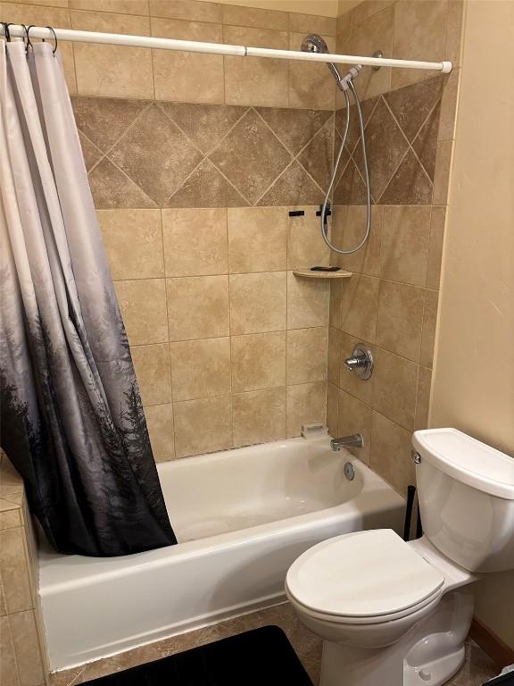 2379 Abbey Ct Unit 3, Steamboat Springs, CO 80487 - bathroom featuring shower / bath combination with curtain and toilet