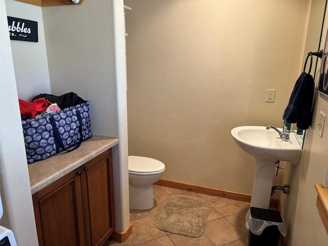 2379 Abbey Ct Unit 3, Steamboat Springs, CO 80487 - bathroom with toilet, tile patterned floors, and baseboards