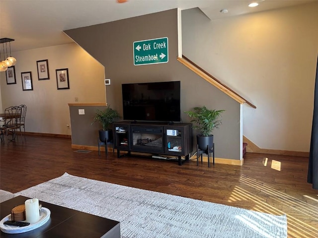 2379 Abbey Ct Unit 3, Steamboat Springs, CO 80487 - living area with wood finished floors, baseboards, stairway, and recessed lighting