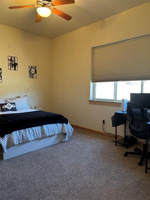 2379 Abbey Ct Unit 3, Steamboat Springs, CO 80487 - carpeted bedroom featuring a ceiling fan and baseboards