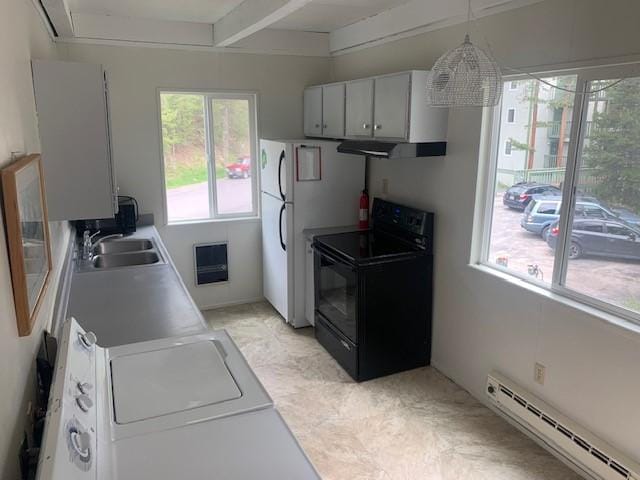 kitchen featuring black / electric stove, baseboard heating, a sink, range hood, and freestanding refrigerator
