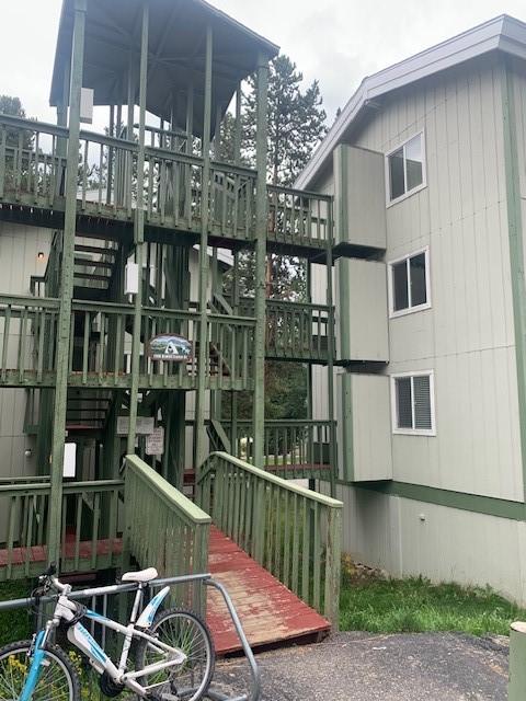 view of side of home with stairway