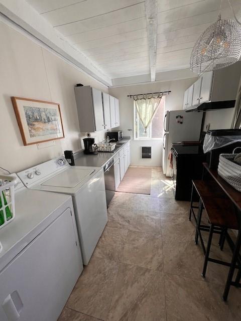 laundry area with washer and dryer and wood ceiling
