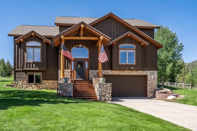 12 Raindance Trl, Dillon, CO 80435 - view of front facade with stone siding, a garage, driveway, roof with shingles, and board and batten siding