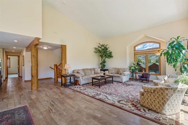 12 Raindance Trl, Dillon, CO 80435 - living room featuring stairway, wood finished floors, and high vaulted ceiling