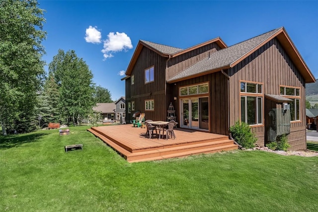 12 Raindance Trl, Dillon, CO 80435 - rear view of house with a wooden deck, a shingled roof, a lawn, and board and batten siding