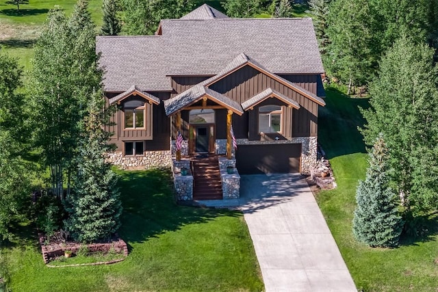 12 Raindance Trl, Dillon, CO 80435 - craftsman-style house with board and batten siding, a front lawn, a shingled roof, concrete driveway, and stone siding