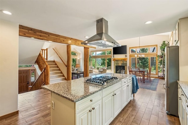 12 Raindance Trl, Dillon, CO 80435 - kitchen with appliances with stainless steel finishes, island range hood, healthy amount of natural light, light wood-type flooring, and recessed lighting