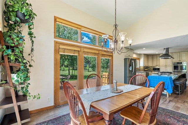 12 Raindance Trl, Dillon, CO 80435 - dining space featuring a chandelier, a towering ceiling, and recessed lighting