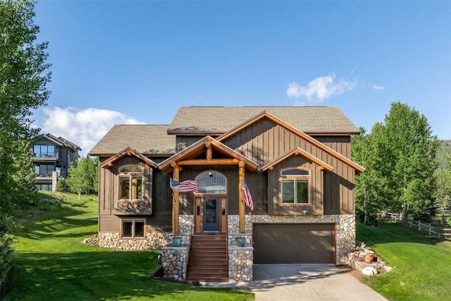 12 Raindance Trl, Dillon, CO 80435 - view of front of home with a garage, stone siding, concrete driveway, and a front yard