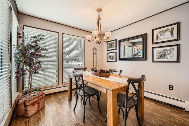120 E Ln Bonte St Unit 109, Dillon, CO 80435 - dining area featuring dark wood-style floors, a chandelier, a baseboard heating unit, and healthy amount of natural light