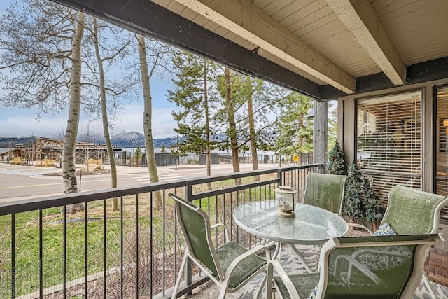 120 E Ln Bonte St Unit 109, Dillon, CO 80435 - sunroom featuring beamed ceiling and a mountain view