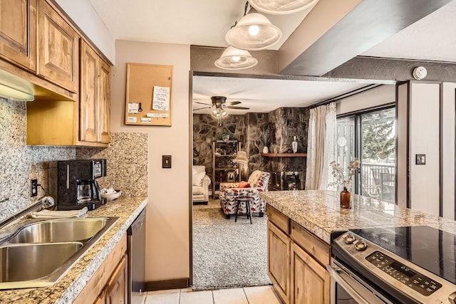 120 E Ln Bonte St Unit 109, Dillon, CO 80435 - kitchen with stainless steel appliances, a sink, ceiling fan, light tile patterned flooring, and light colored carpet