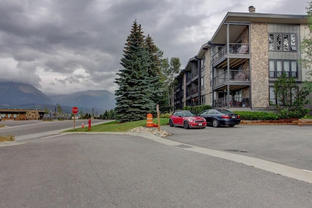 120 E Ln Bonte St Unit 109, Dillon, CO 80435 - view of building exterior with a mountain view and uncovered parking