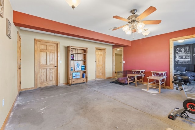 miscellaneous room with concrete floors and ceiling fan