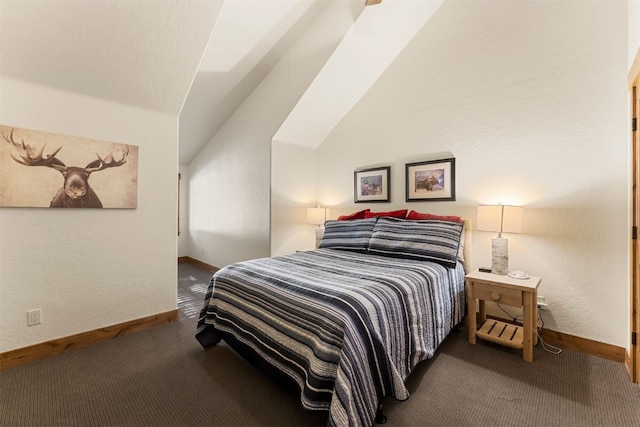 bedroom with lofted ceiling, a textured wall, carpet, and baseboards