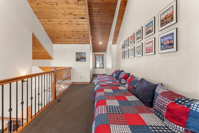 unfurnished bedroom with vaulted ceiling with beams, wood ceiling, baseboards, and carpet flooring