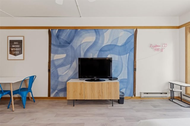 living room featuring hardwood / wood-style flooring and baseboard heating