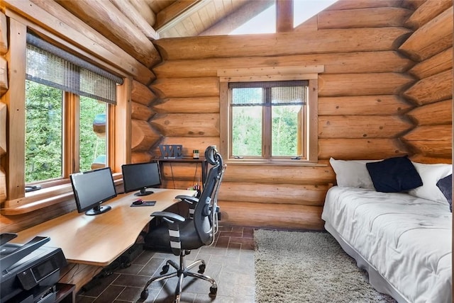 home office with log walls and a wealth of natural light