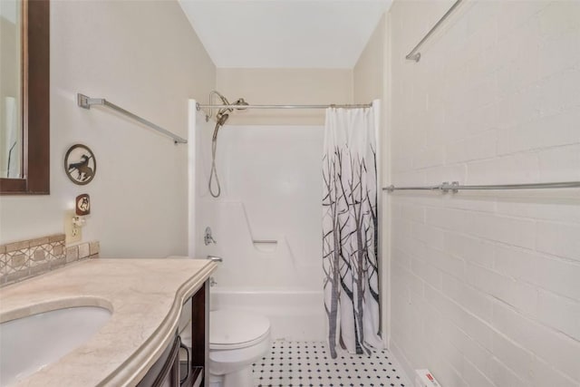 full bathroom with vanity, toilet, and shower / bath combo with shower curtain