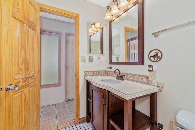 bathroom featuring vanity, toilet, and tile patterned floors