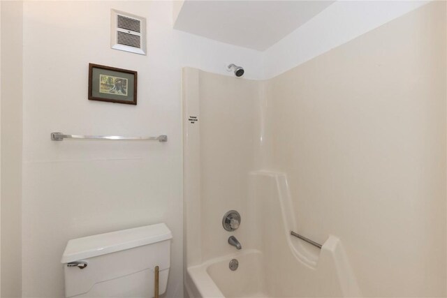 bathroom with toilet and shower / bathtub combination