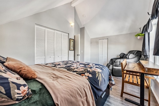 bedroom with light wood-type flooring and lofted ceiling with beams