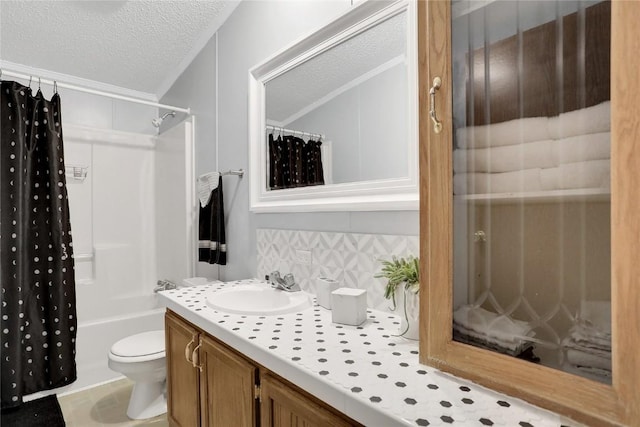 full bathroom with vanity, tile patterned flooring, toilet, a textured ceiling, and tasteful backsplash