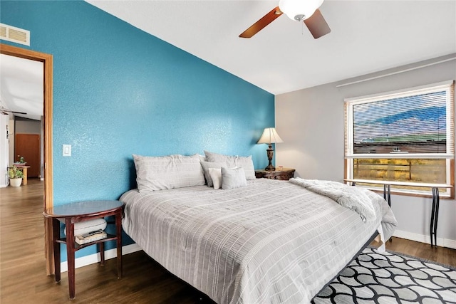 bedroom with hardwood / wood-style flooring and ceiling fan