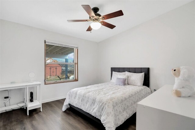 bedroom with ceiling fan and dark hardwood / wood-style flooring